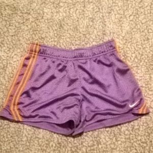 Nike shorts, size s, purple with orange stripes.
